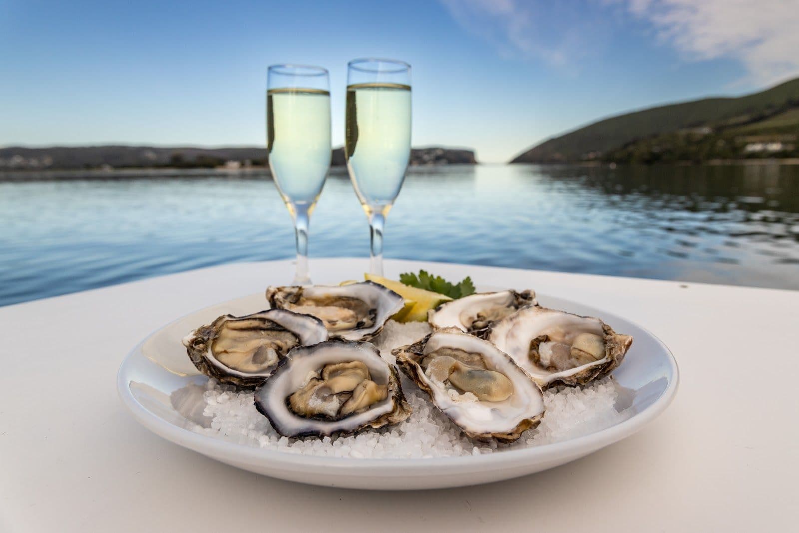 Oysters and champagne served on the water